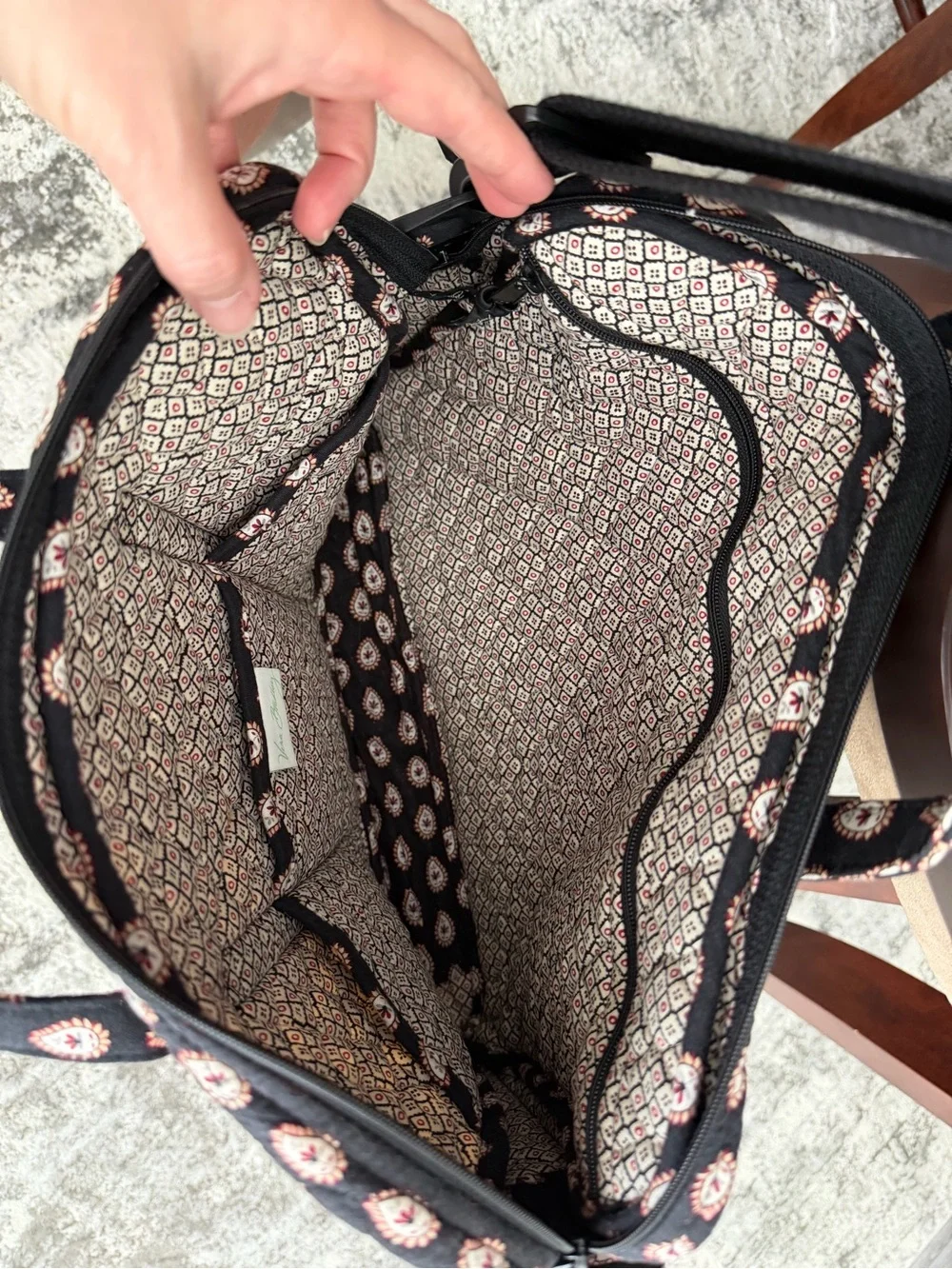 Quilted Black Vera Bradley laptop bag with adjustable strap